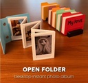 Álbum de fotos instantáneas de escritorio con carpeta abierta